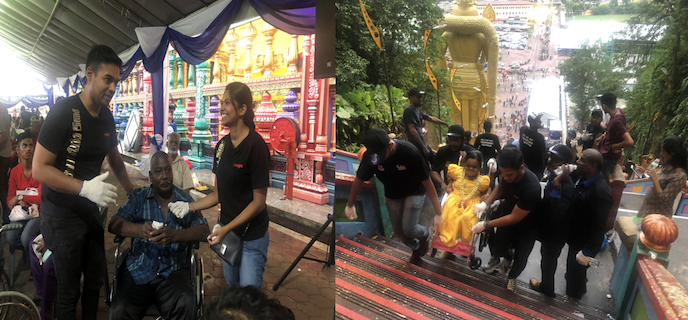RAAGA volunteers carry disabled up Batu Caves
